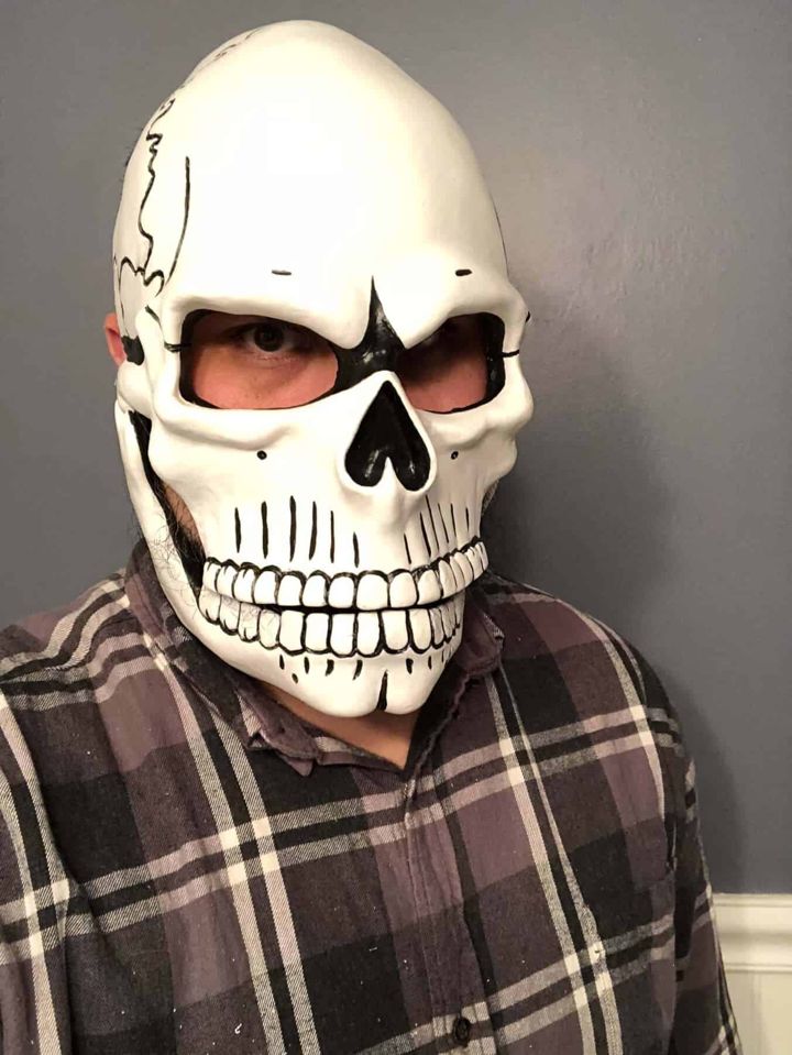 Painted Day of the Dead skull mask being worn