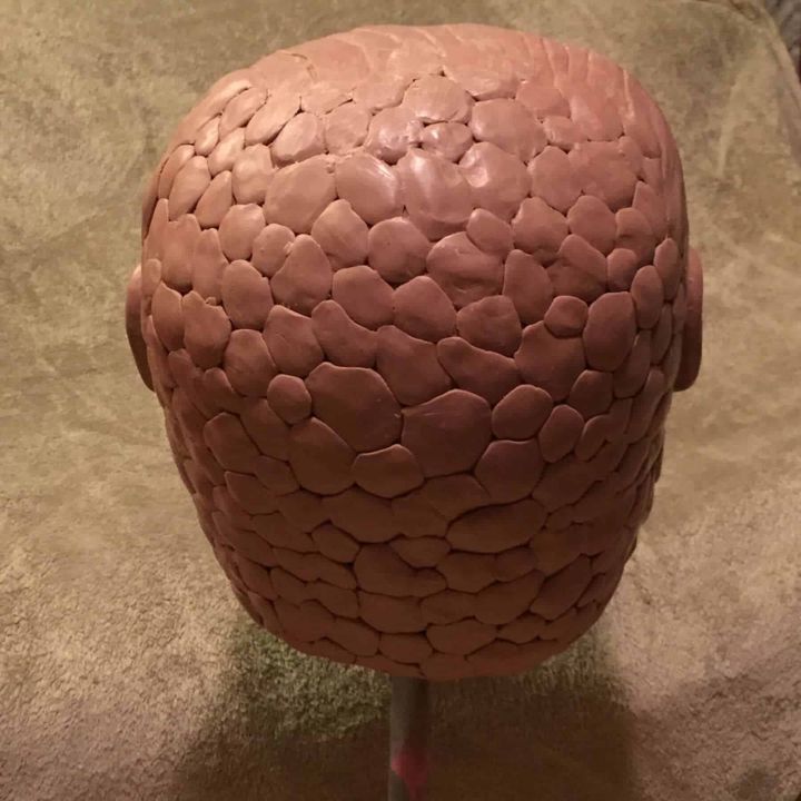 Back of the Snaggletooth clay sculpt showing texture
