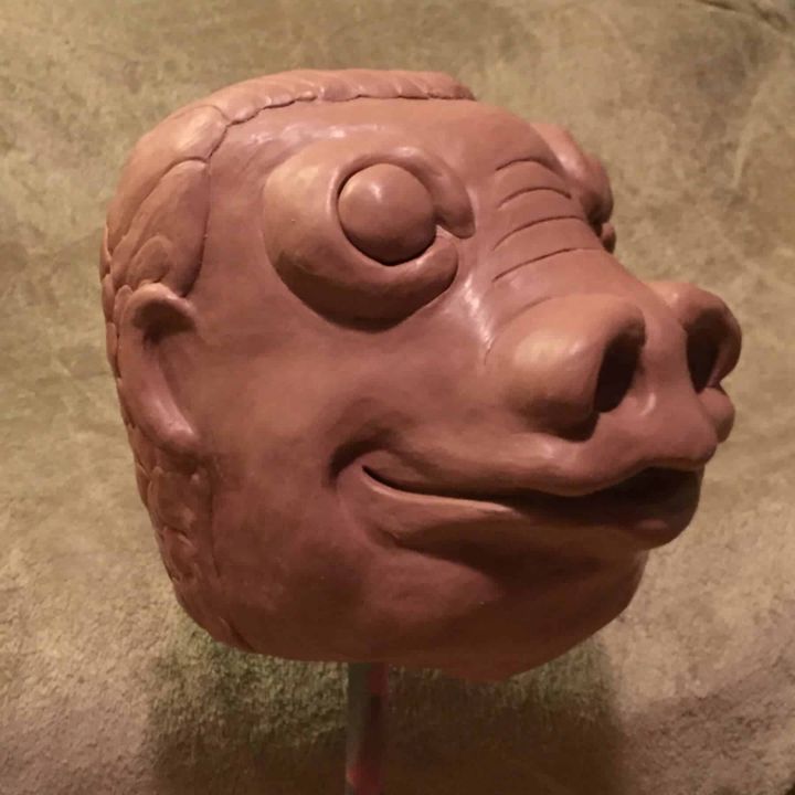 Profile of the Snaggletooth clay sculpt