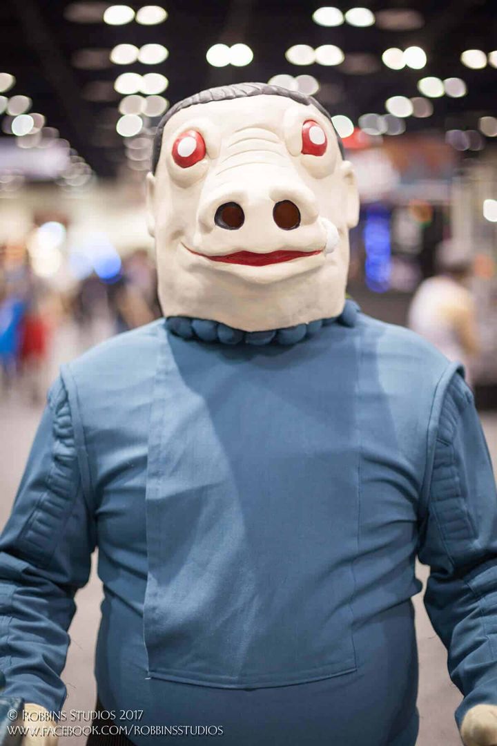 Full Kenner Snaggletooth costume in blue suit at a convention