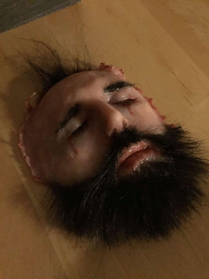 Finished silicone face replica lying face up