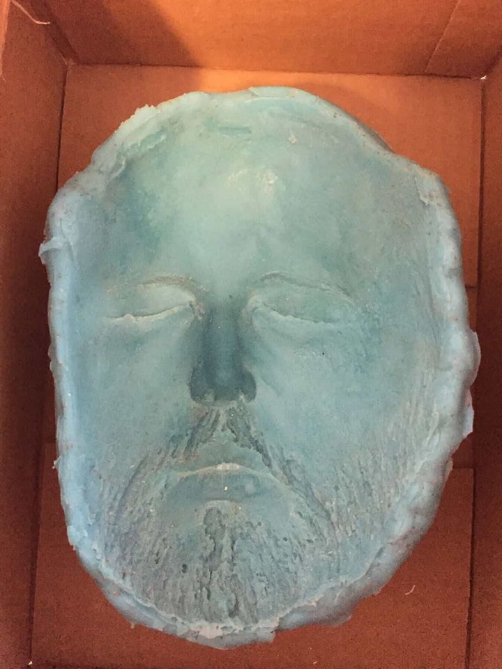 Blue alginate lifecast mold of a face