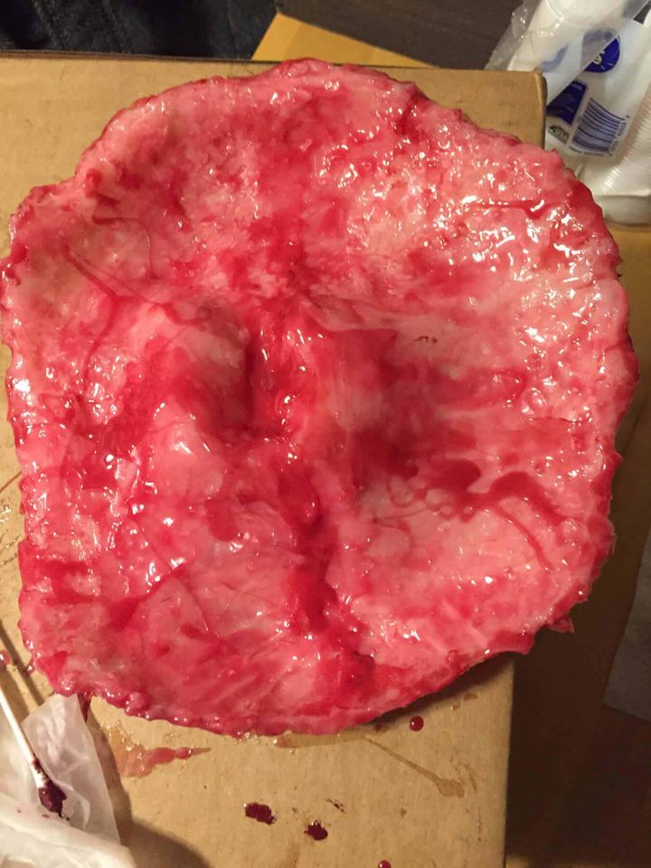 Silicone face with first layers of red skin tone