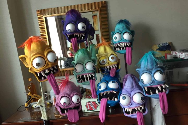 Row of finished Weird-Oh masks on display